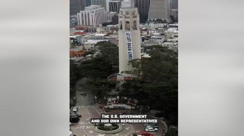 نشطاء يهود يرفعون لافتة "دع غزة تعيش" على برج Coit الشهير (فيديو)